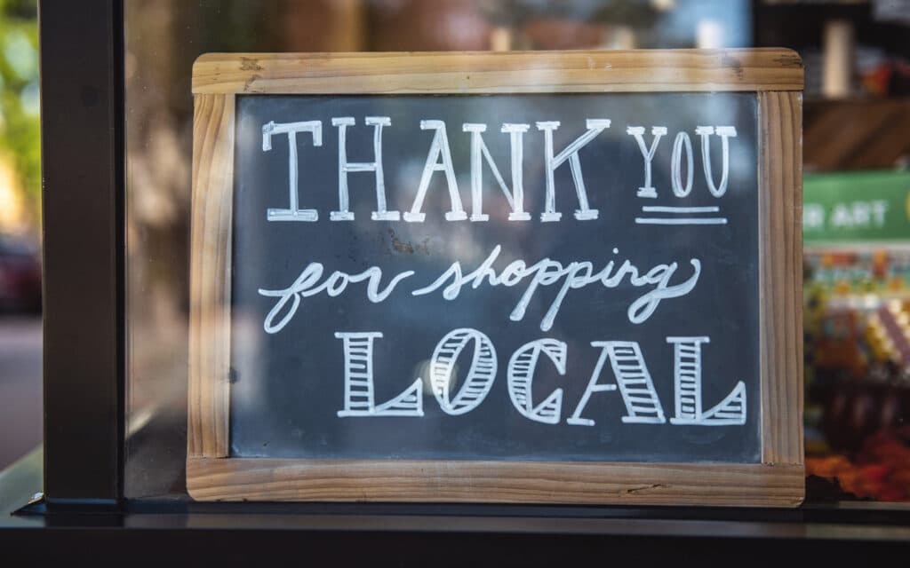 Thank you for shopping local sign in shop window picture by Tim-Mossholder